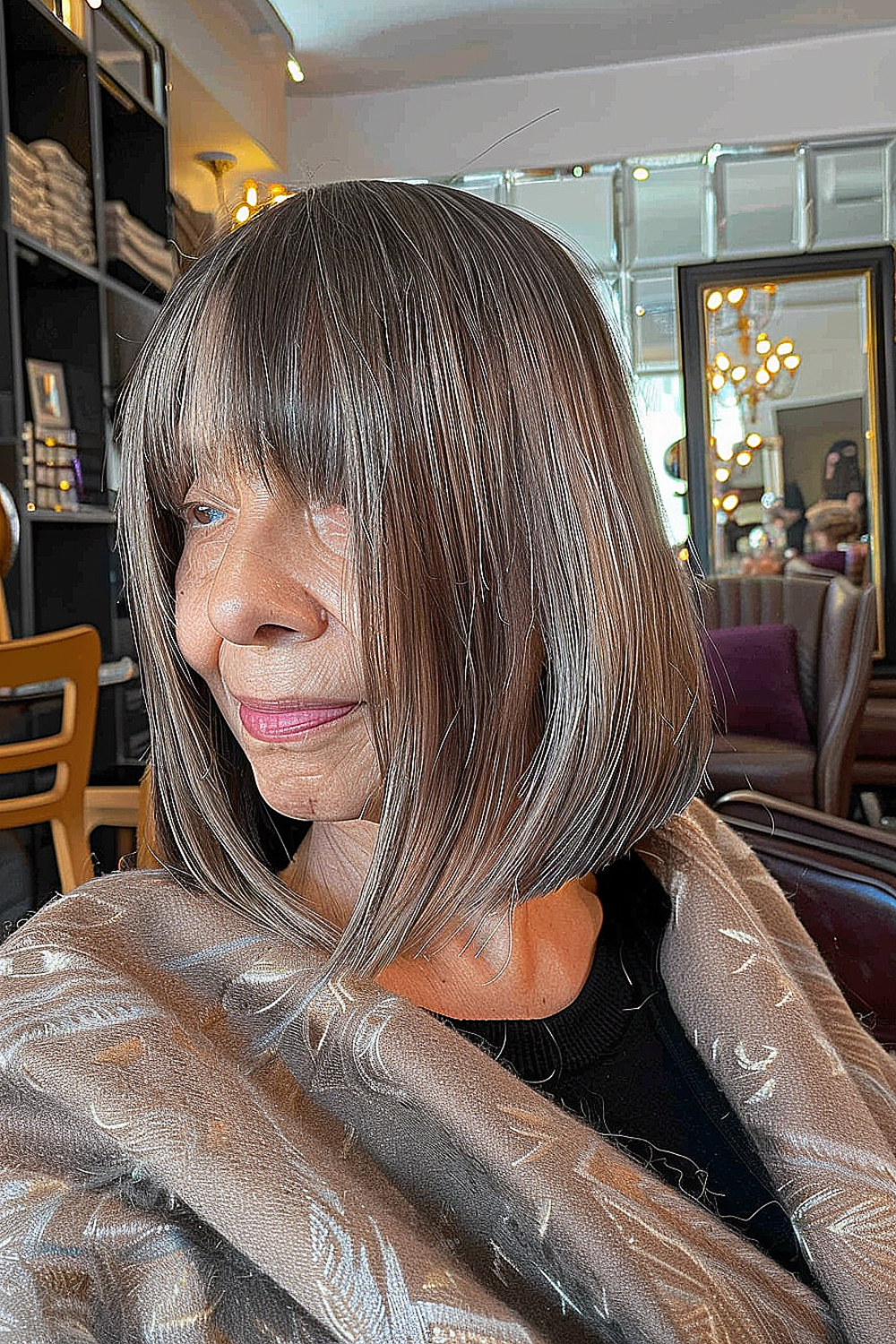 Angled layers hairstyle with wispy bangs