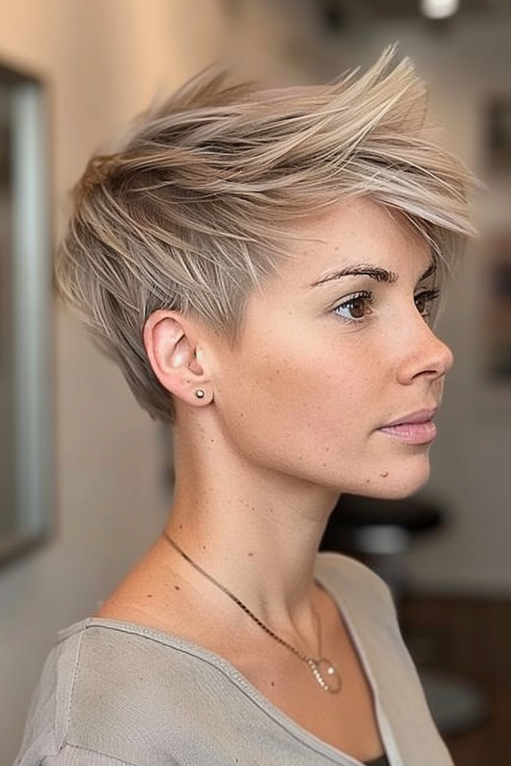 Ashy blonde layered pixie with textured top