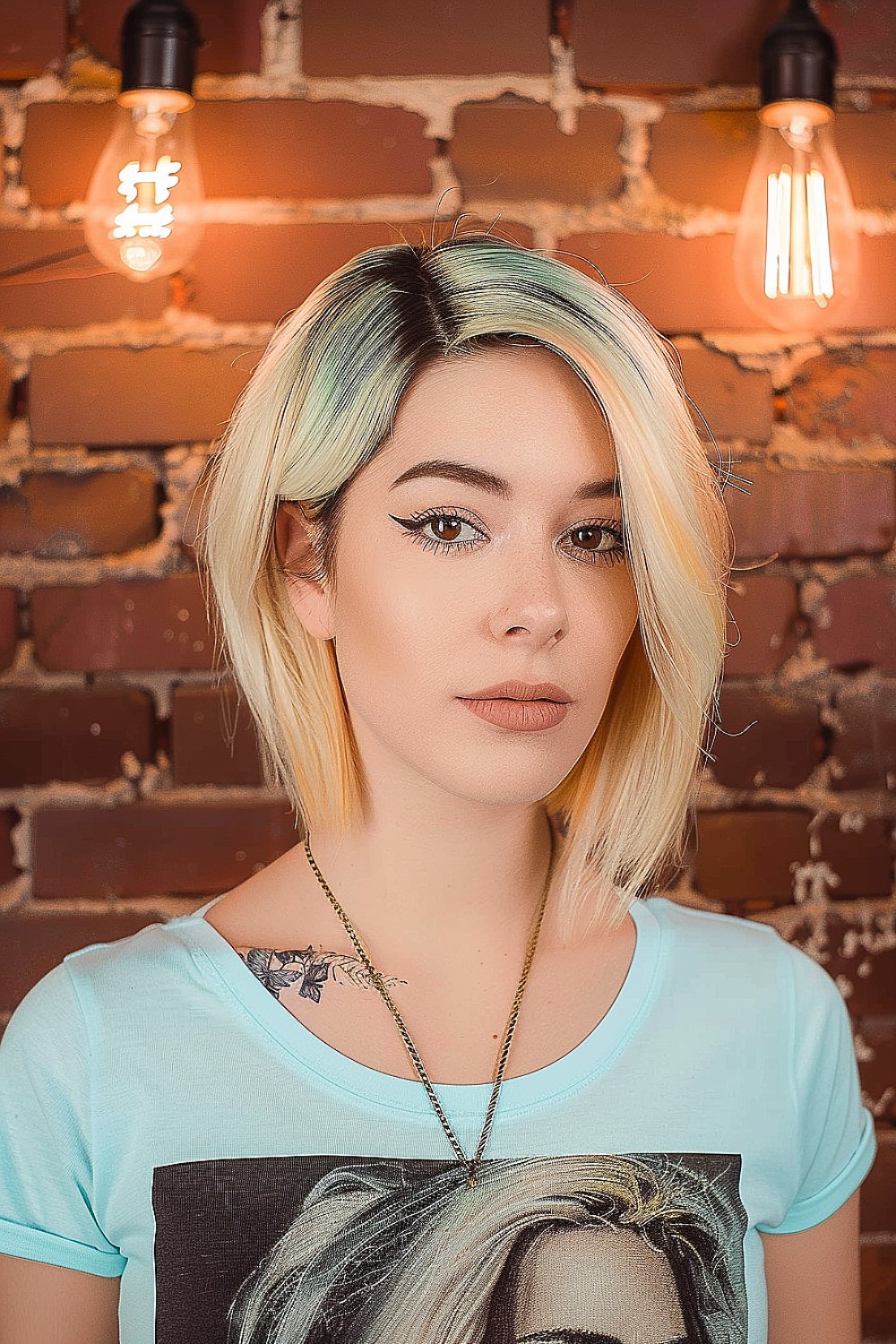 Asymmetrical blunt bob with platinum blonde and dark roots