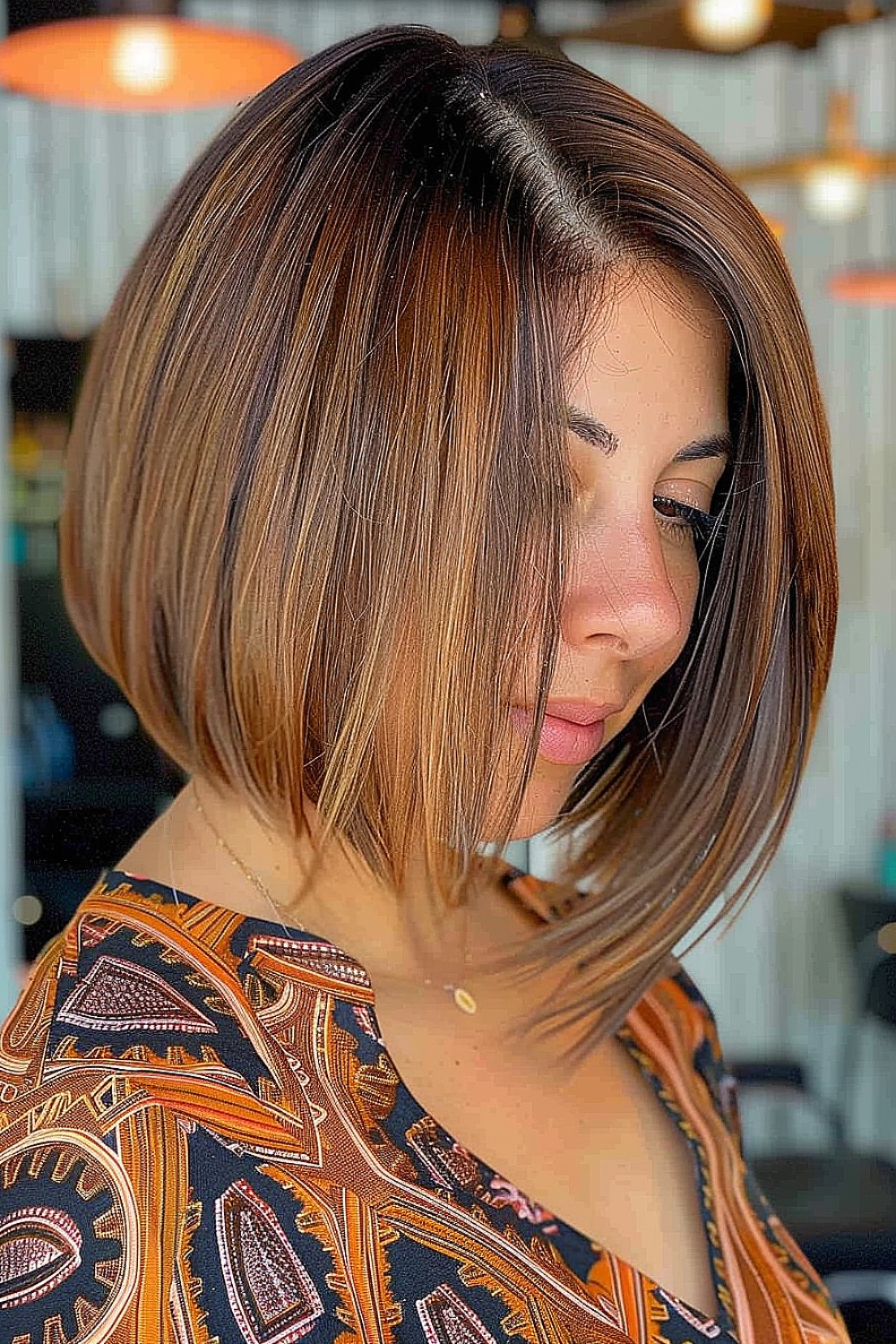 Asymmetrical inverted bob with caramel highlights