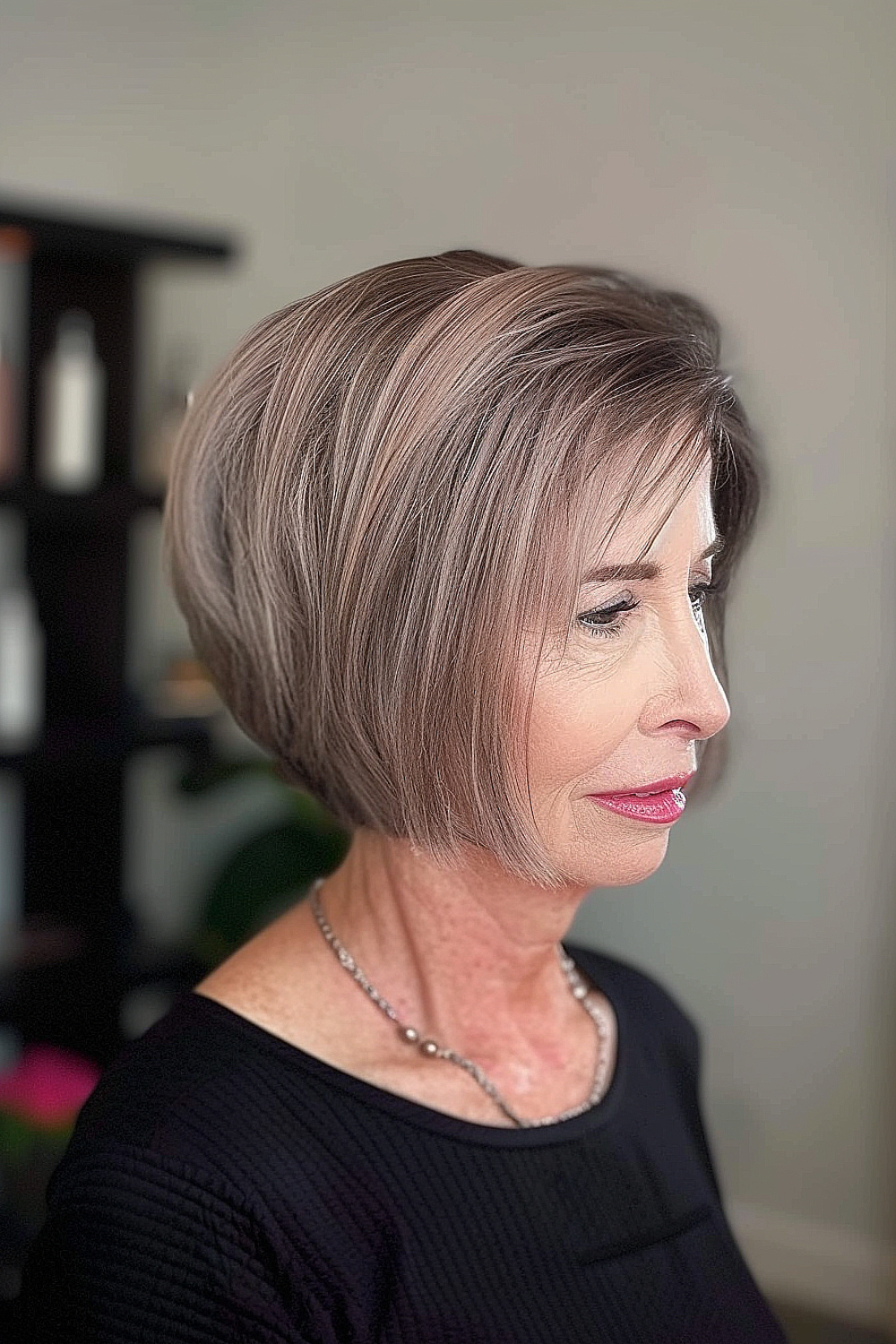 Chin-length A-line bob hairstyle with side-swept bangs.