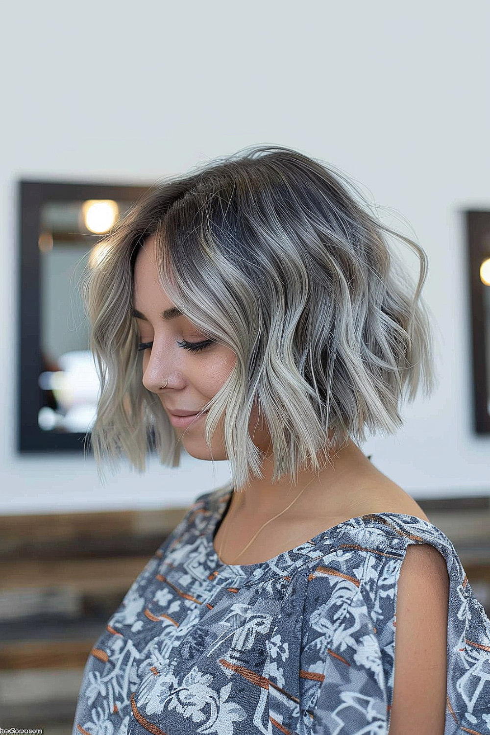 Woman with a choppy bob and silver highlights