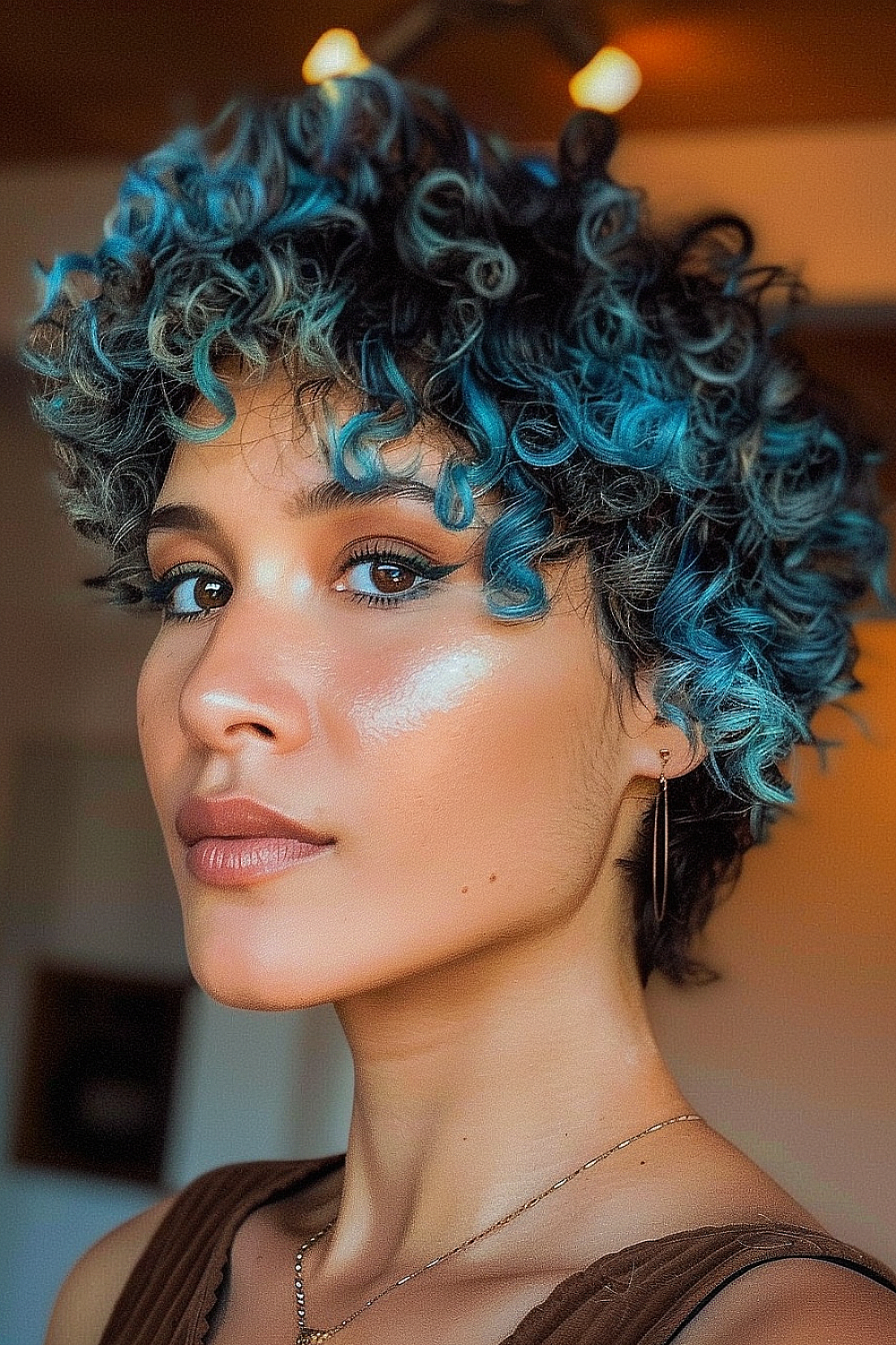 Curly pixie with highlighted tips for flair