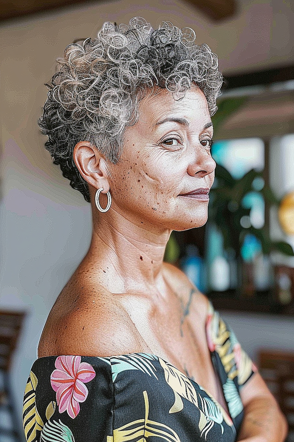 Curly tapered pixie with defined tight curls.