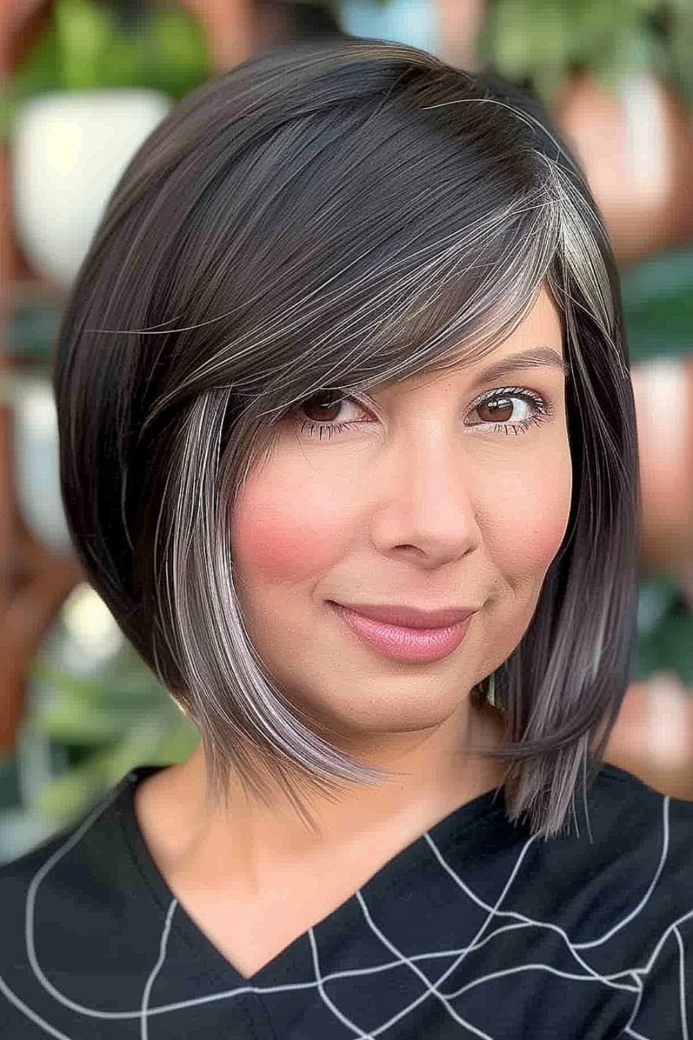 Woman with a graduated layered bob and side-swept bangs