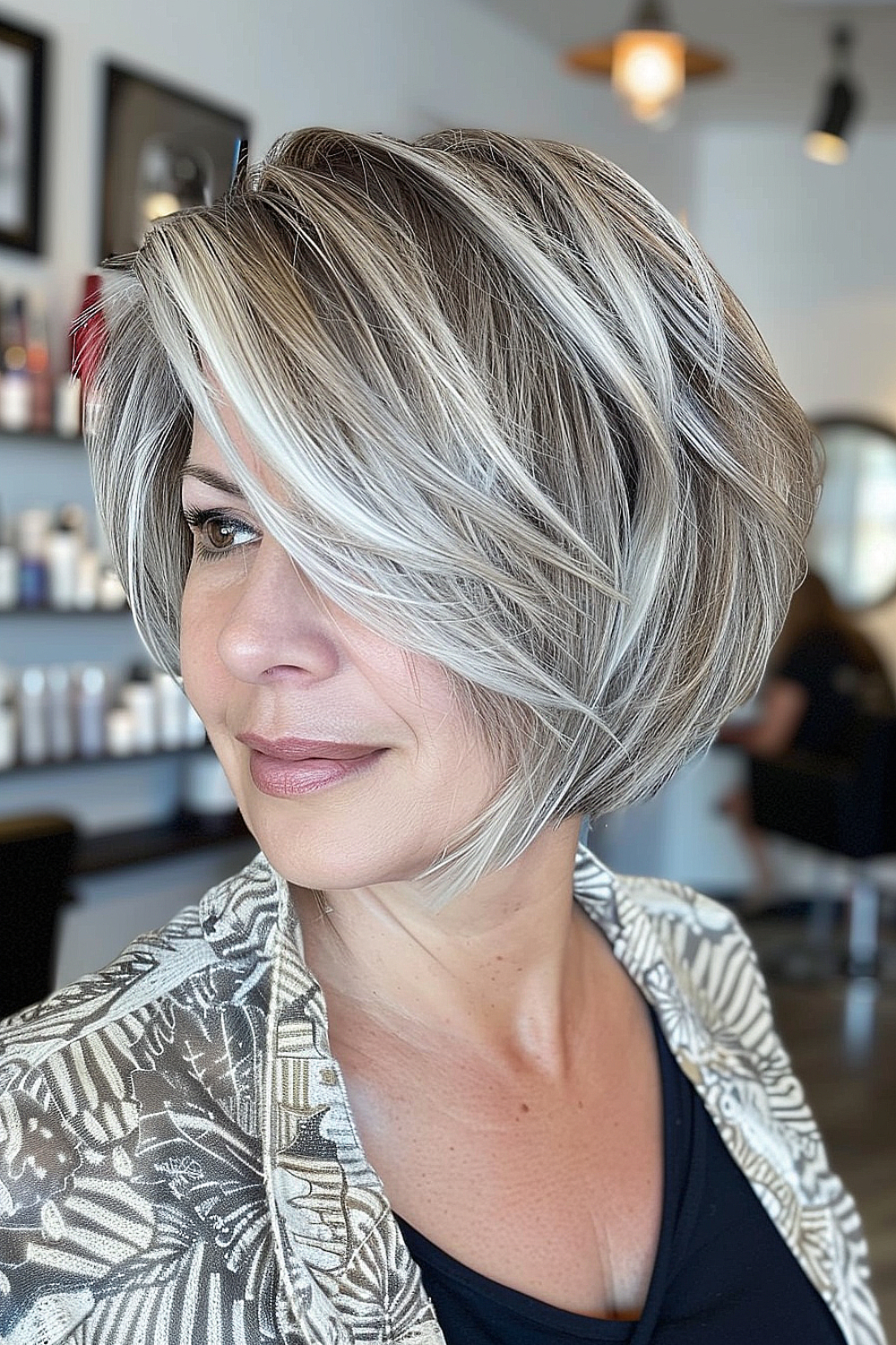 Woman with a layered bob and ash blonde highlights