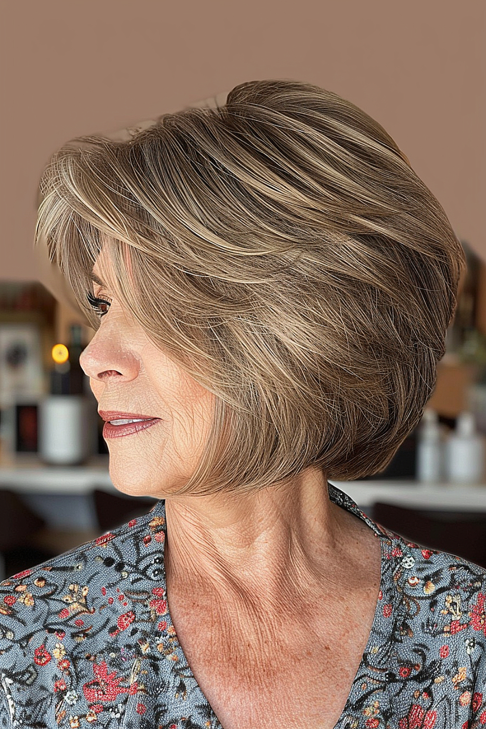 Layered bob with side bangs for women over 60