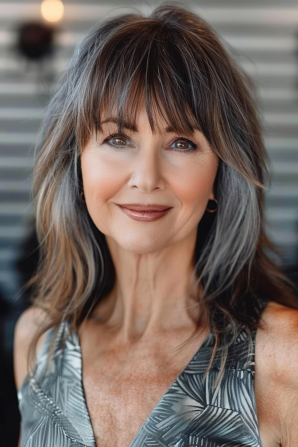 Layered cut with bangs for women over 50