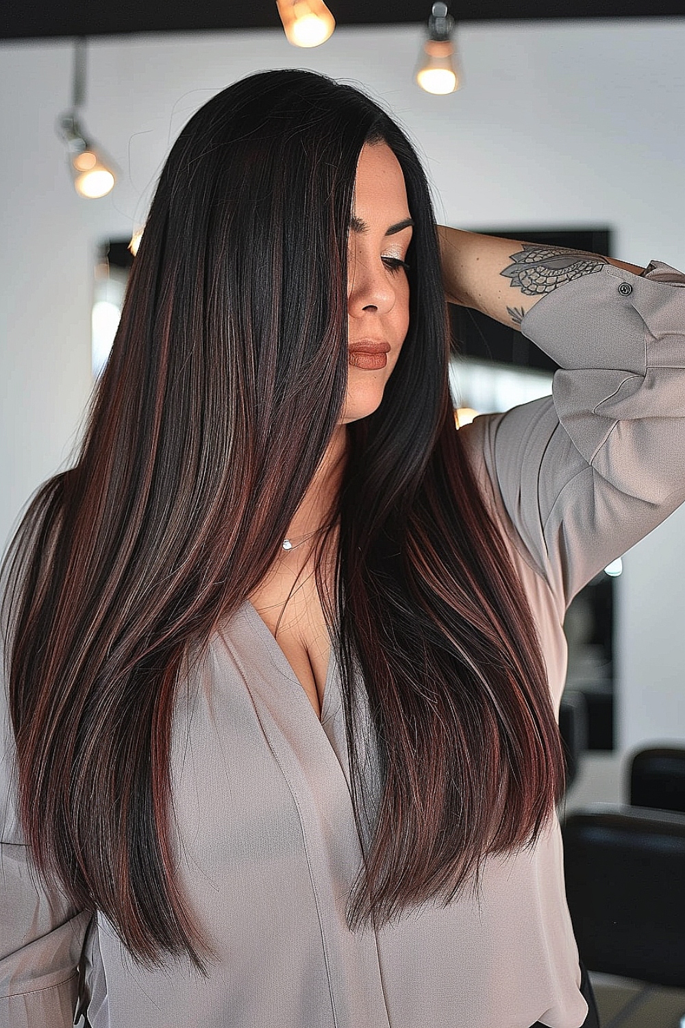 Long A-line cut with subtle red undertones on dark hair