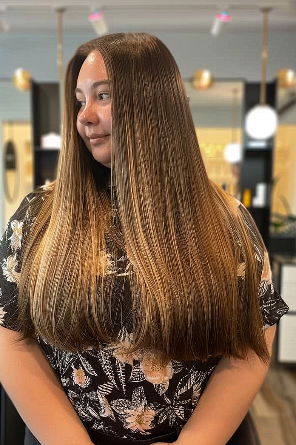 Long straight hair with blunt ends and subtle highlights