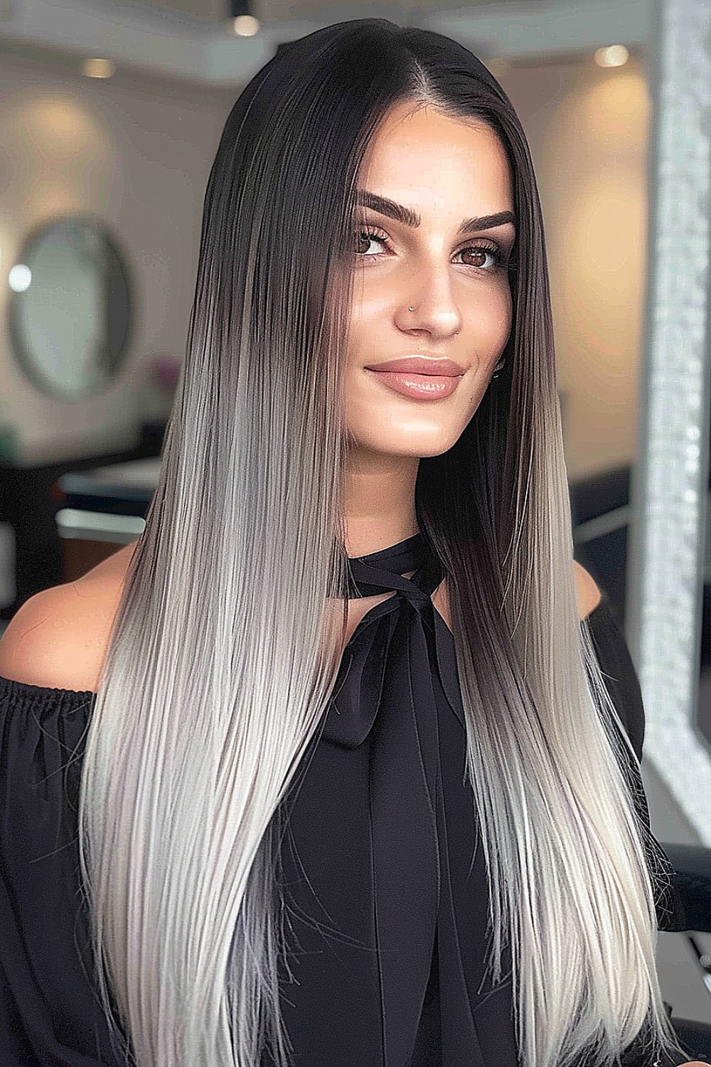 Woman with long straight hair featuring an ombre color transition