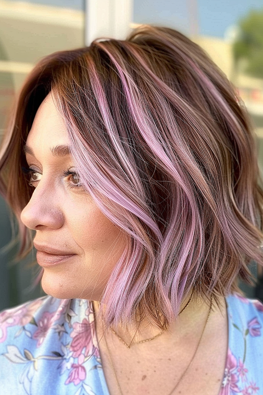 Razor cut bob with soft pastel pink streaks