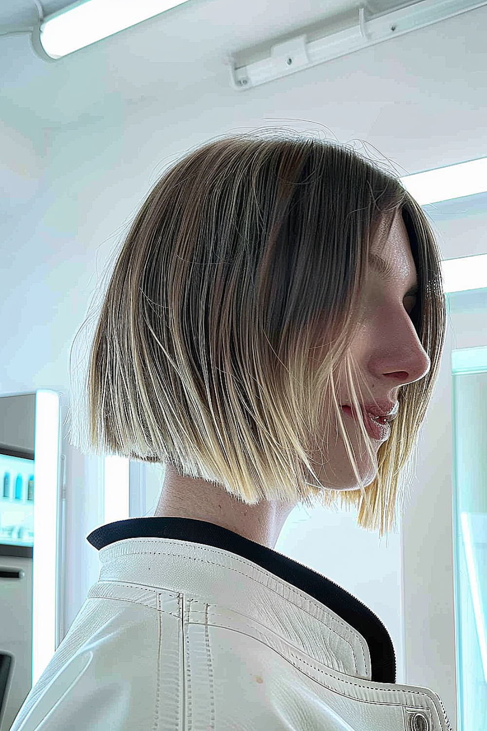 Razor cut bob with sleek contouring and subtle highlights