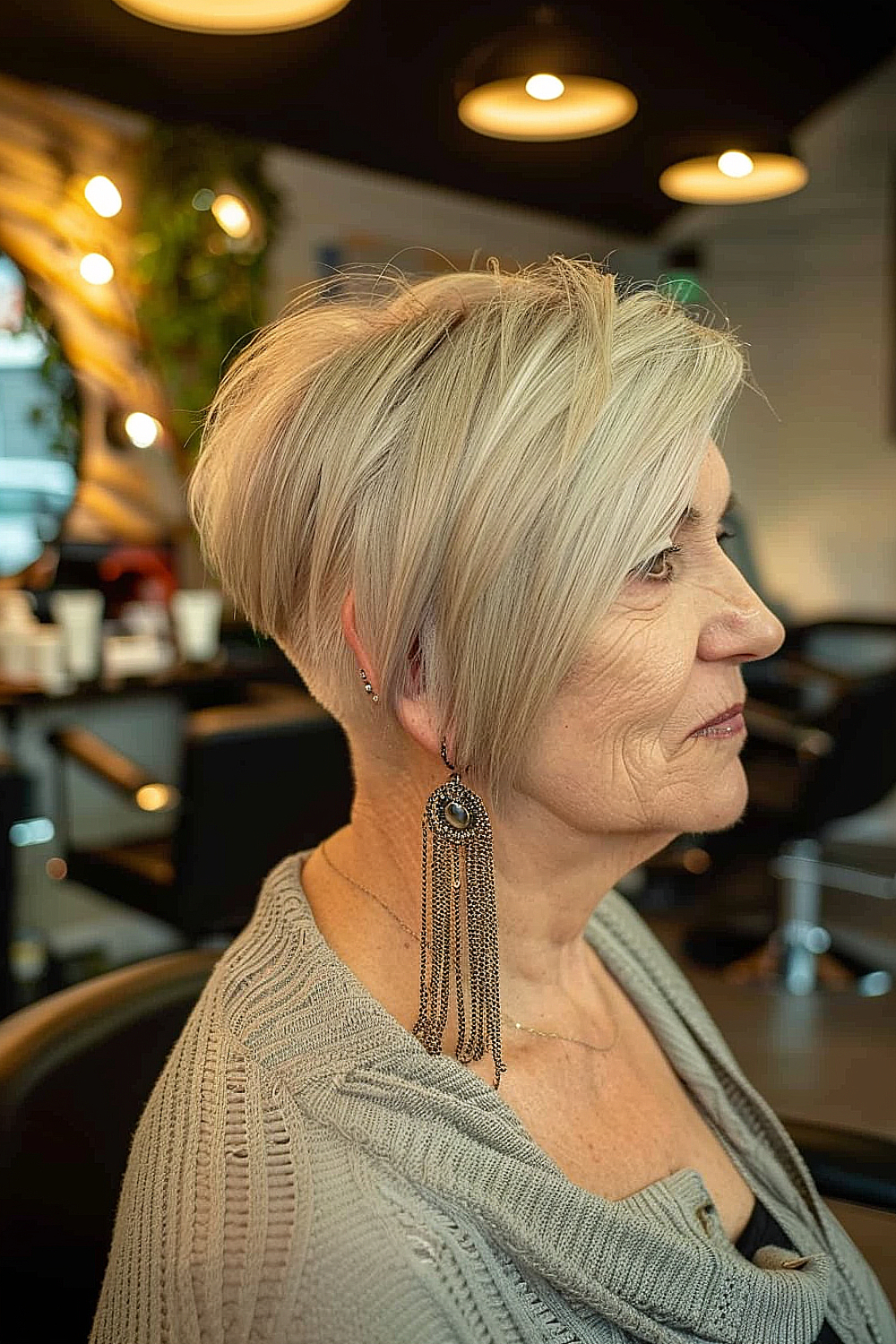 Sleek razor cut bob with undercut for mature women