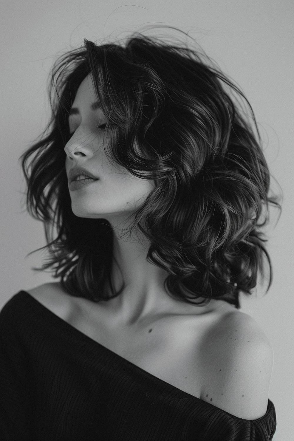 Shoulder-length hair with loose curls