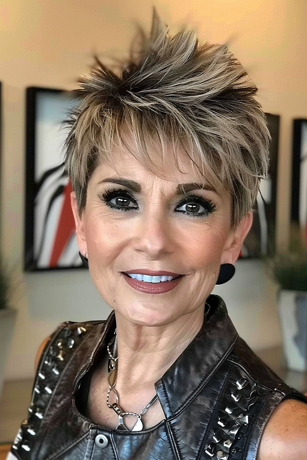 A woman with a spiky pixie cut and edgy bangs