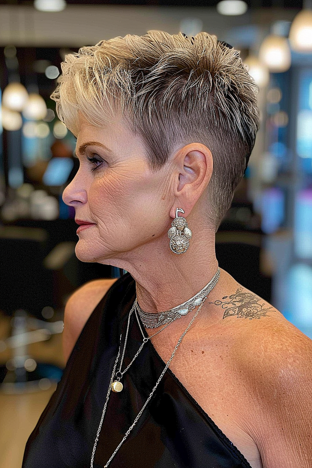 Woman with a tapered pixie cut and elegant highlights