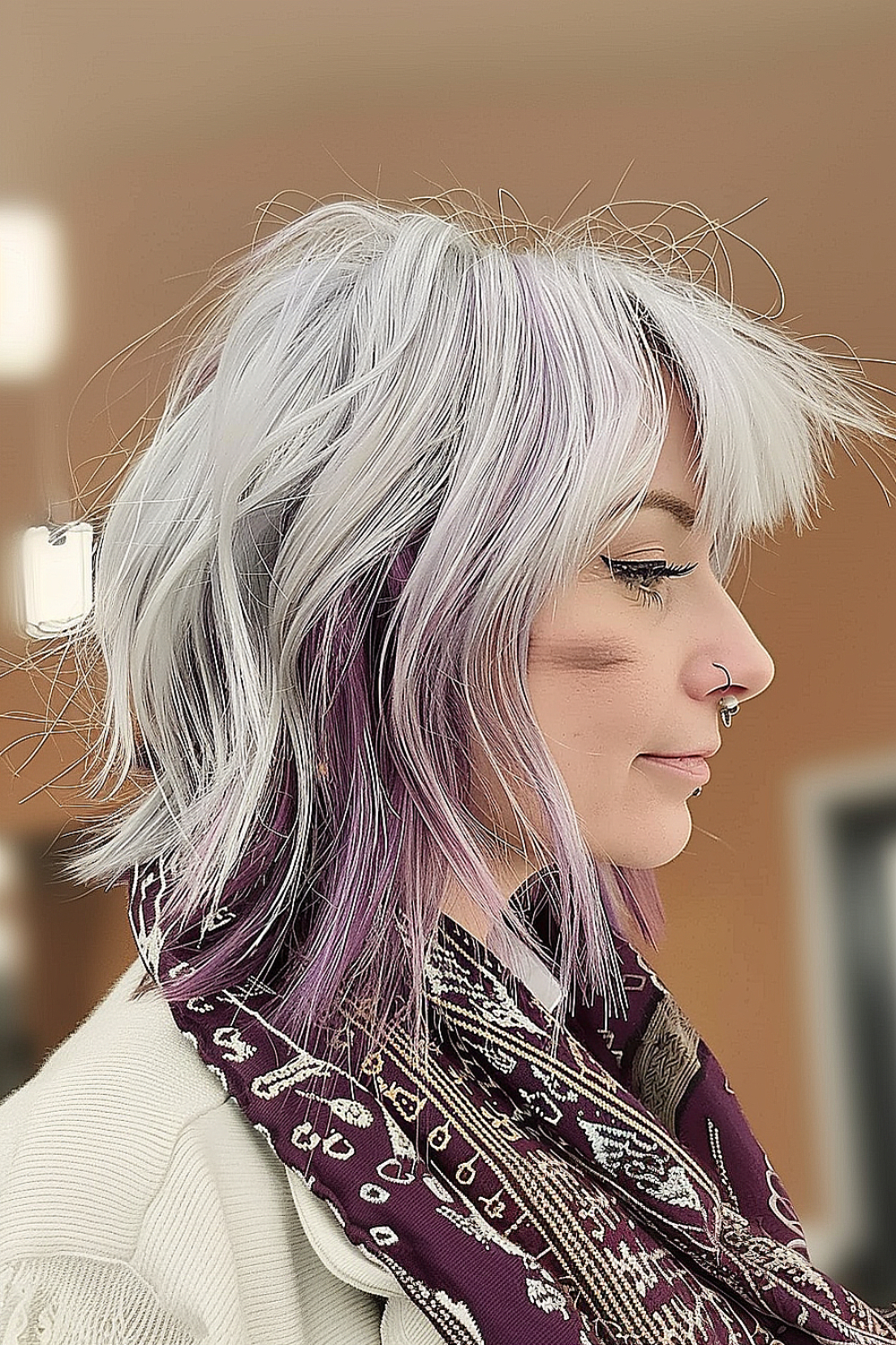 Woman with a textured shag haircut and peek-a-boo color