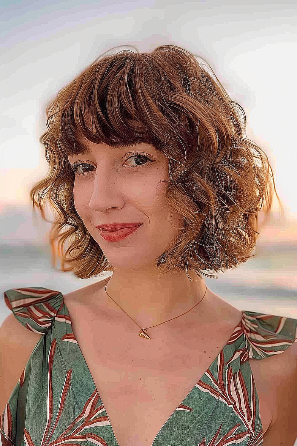 Wavy razor cut bob with natural curls and textured ends